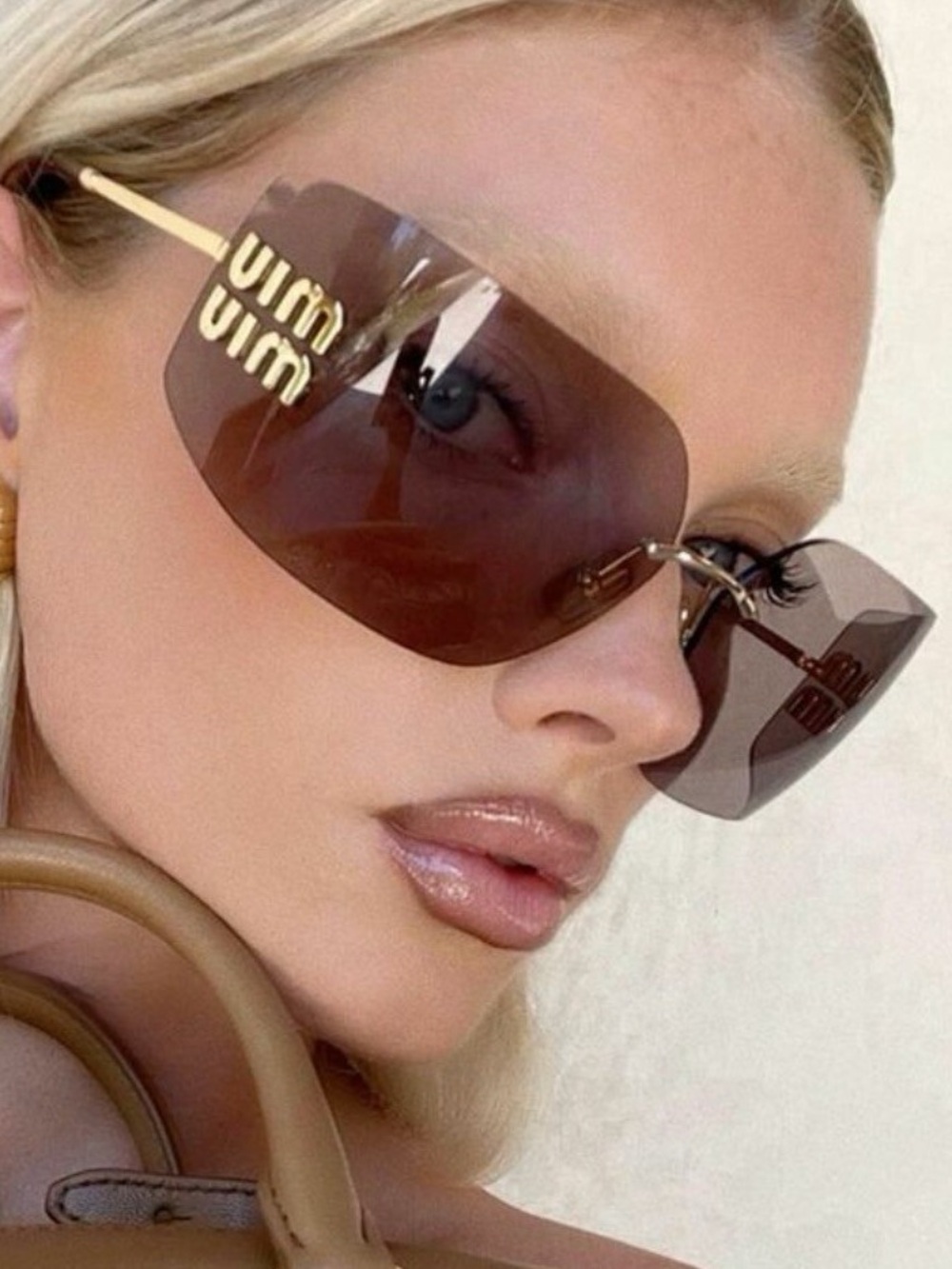 Miu Miu Rimless Sunglasses with Violet Lenses and Gold Logo